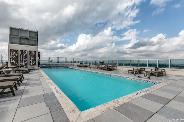 view of pool featuring a patio