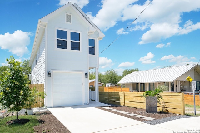 244 Porter St, San Antonio, TX 78210 - exterior space with an attached garage, a fenced front yard, and driveway