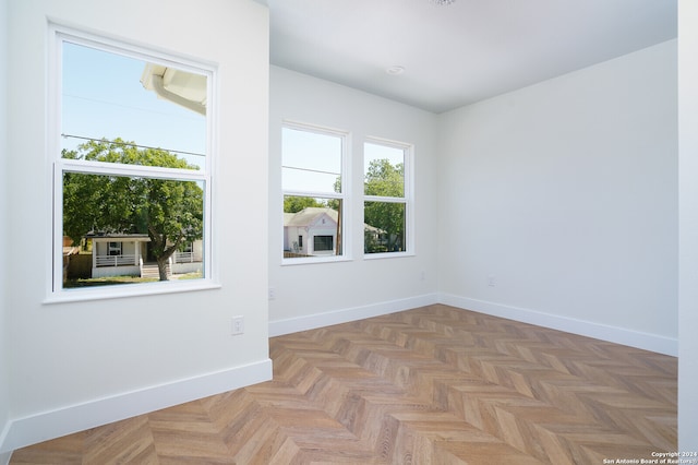 spare room featuring light parquet floors