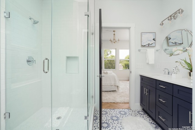 244 Porter St, San Antonio, TX 78210 - ensuite bathroom with a stall shower, vanity, ensuite bathroom, and a notable chandelier