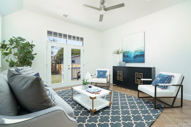 living room with parquet flooring, french doors, vaulted ceiling, and ceiling fan