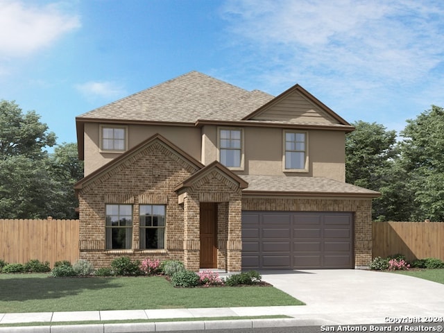 view of front of house with a garage and a front lawn