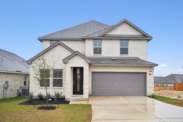 1327 Larkspur Pass, San Antonio, TX 78245 - kitchen with a breakfast bar area, appliances with stainless steel finishes, an island with sink, dark hardwood / wood-style flooring, and decorative backsplash