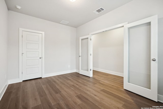 1327 Larkspur Pass, San Antonio, TX 78245 - unfurnished bedroom featuring hardwood / wood-style floors