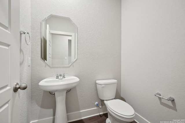 1327 Larkspur Pass, San Antonio, TX 78245 - bathroom with wood-type flooring and toilet