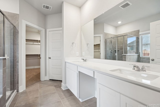 1327 Larkspur Pass, San Antonio, TX 78245 - bathroom with vanity, tile patterned flooring, and walk in shower
