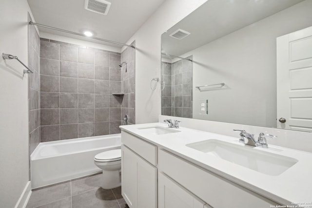 1327 Larkspur Pass, San Antonio, TX 78245 - full bathroom with tiled shower / bath, vanity, toilet, and tile patterned flooring