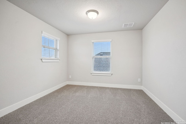 1327 Larkspur Pass, San Antonio, TX 78245 - empty room with a textured ceiling and carpet flooring