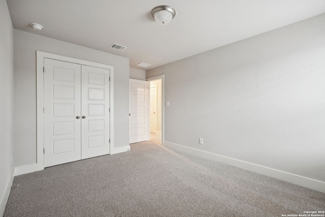 1327 Larkspur Pass, San Antonio, TX 78245 - unfurnished bedroom featuring a closet and carpet