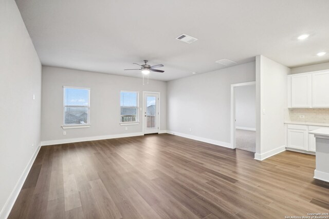 1327 Larkspur Pass, San Antonio, TX 78245 - carpeted bedroom featuring ceiling fan, multiple windows, and a textured ceiling