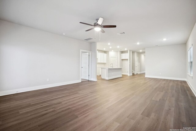 1327 Larkspur Pass, San Antonio, TX 78245 - carpeted bedroom featuring multiple windows