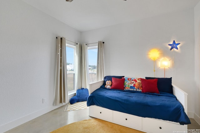 bedroom with concrete flooring