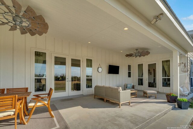 view of patio / terrace featuring an outdoor hangout area, french doors, and ceiling fan