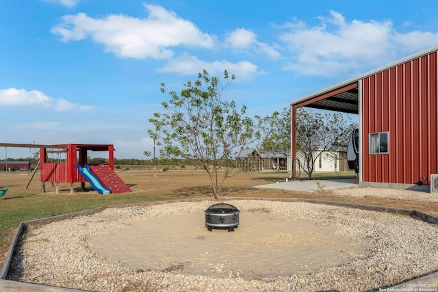 view of jungle gym with a patio and a lawn