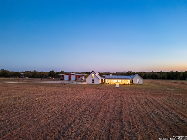 ranch-style house featuring a storage shed