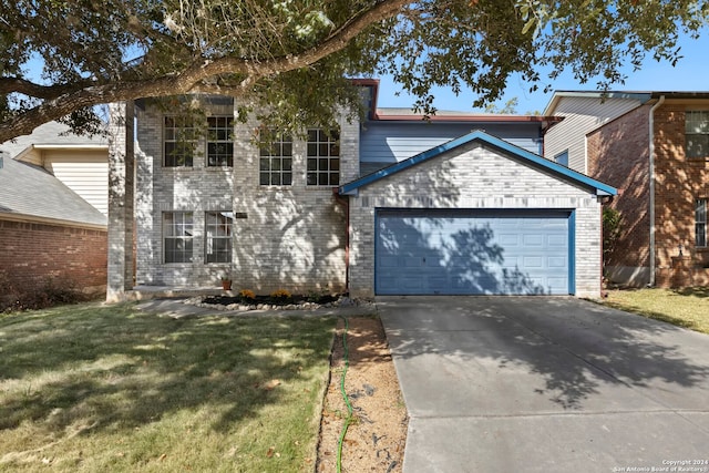 front of property with a front yard and a garage