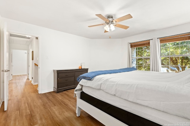 bedroom featuring ceiling fan and light hardwood / wood-style flooring