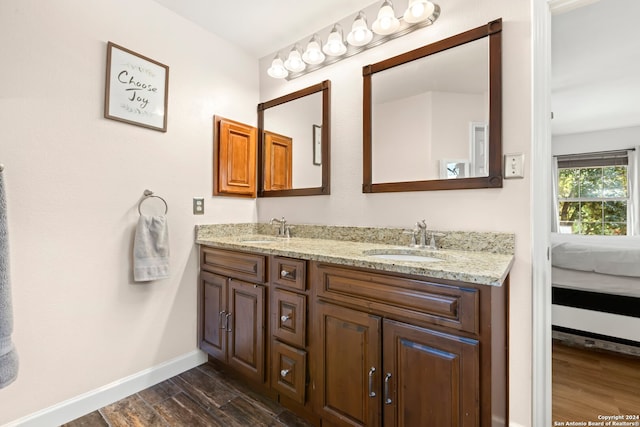 bathroom featuring vanity and wood-type flooring