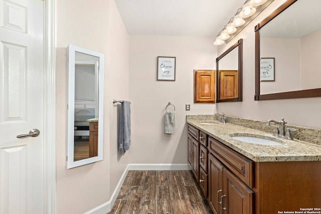 bathroom with vanity and wood-type flooring