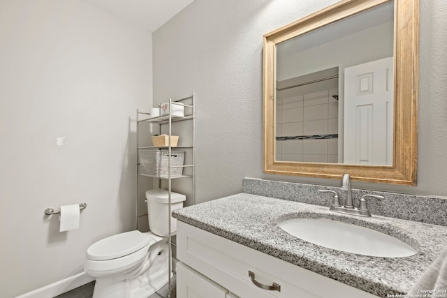 bathroom with toilet and vanity