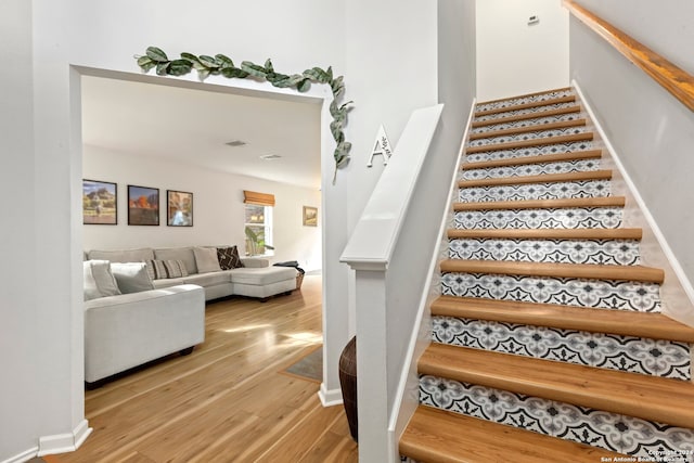 stairway featuring hardwood / wood-style floors