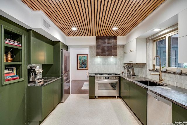 kitchen with white cabinets, green cabinets, sink, and appliances with stainless steel finishes