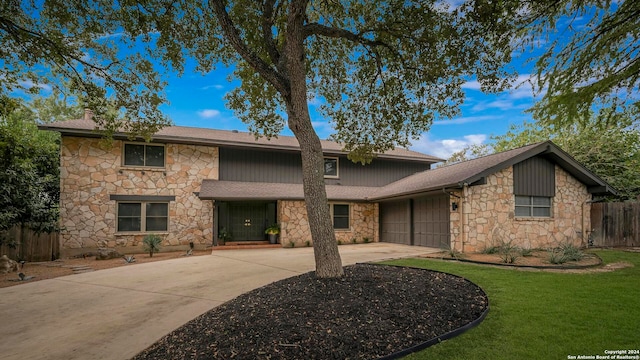 view of front facade with a front lawn and a garage