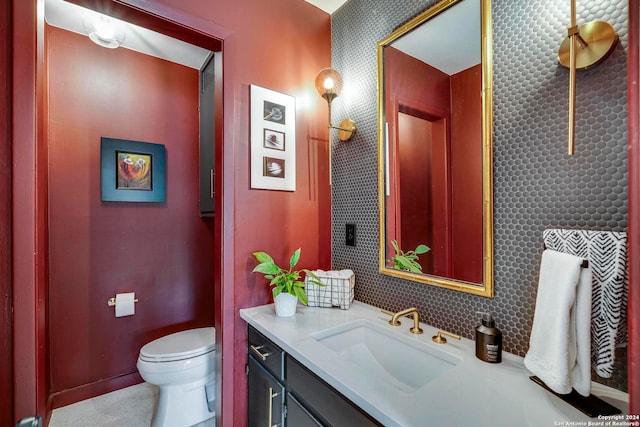 bathroom with toilet and vanity