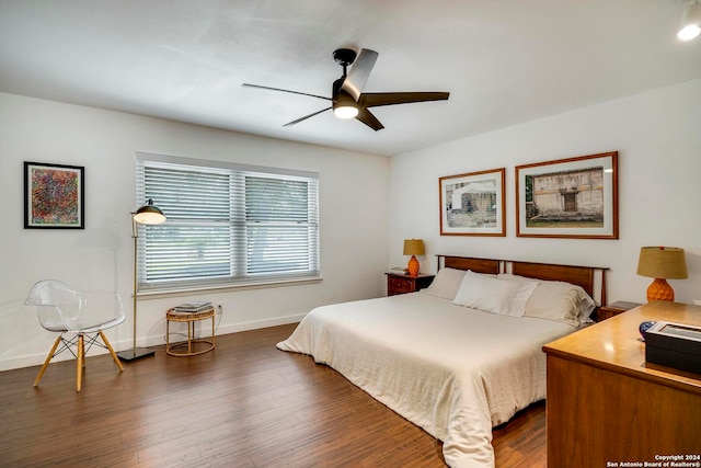 bedroom featuring dark wood-type flooring and ceiling fan