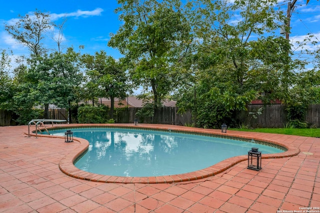 view of swimming pool featuring a patio