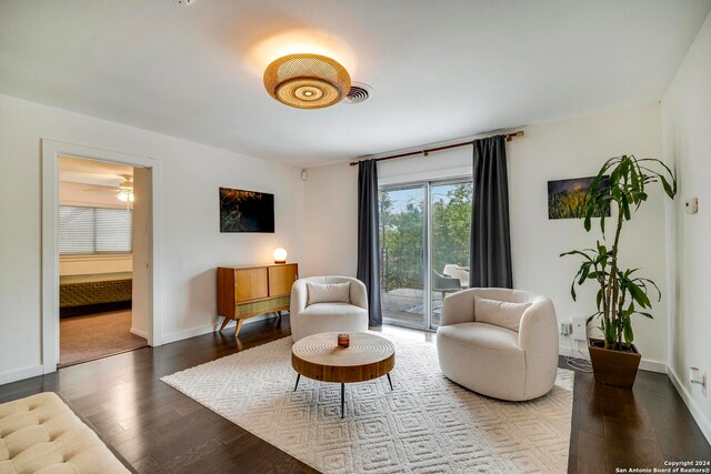 sitting room featuring wood-type flooring