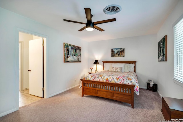 carpeted bedroom with ceiling fan