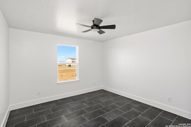 unfurnished room featuring a textured ceiling and ceiling fan