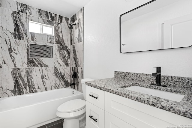 full bathroom with vanity, toilet, tiled shower / bath combo, and tile patterned flooring