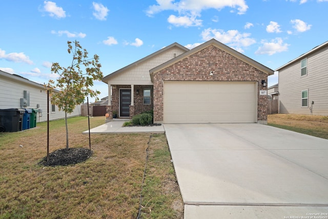 view of front of house featuring a front yard and a garage