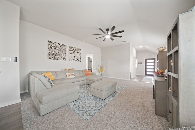 living room featuring lofted ceiling, hardwood / wood-style floors, and ceiling fan