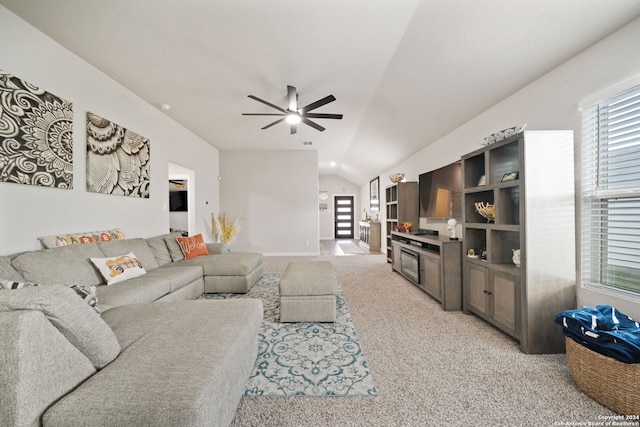 living room with light carpet, ceiling fan, and vaulted ceiling