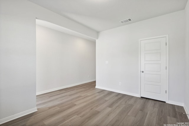 spare room with light hardwood / wood-style floors