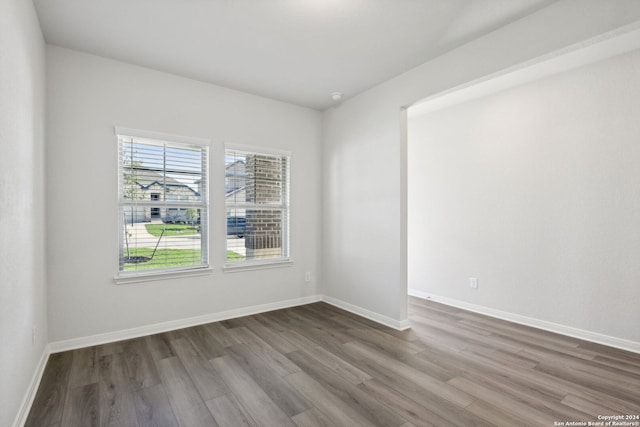 spare room featuring hardwood / wood-style floors