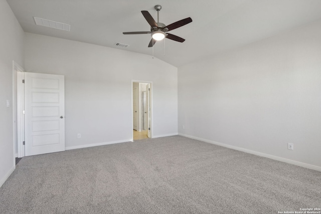 carpeted empty room with ceiling fan and vaulted ceiling