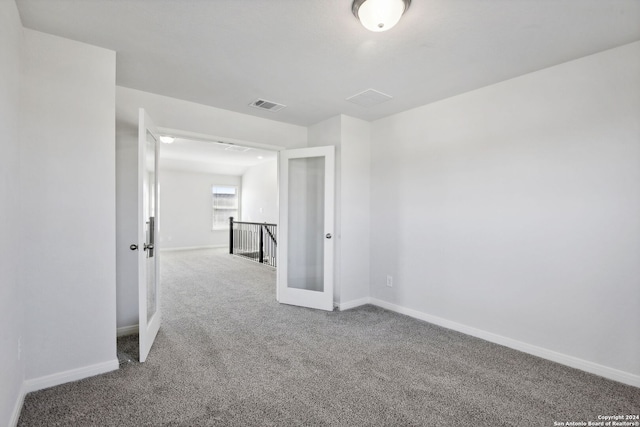 unfurnished room with carpet floors