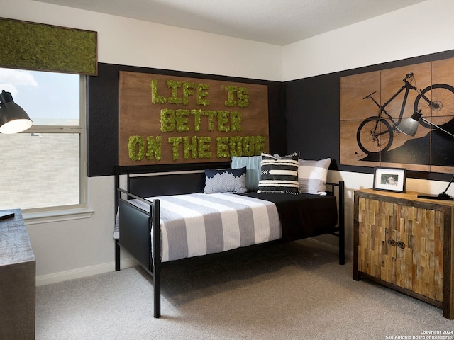 bedroom featuring light carpet