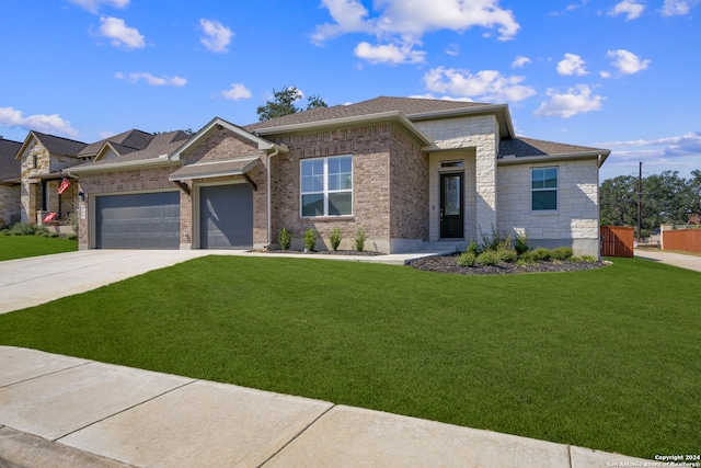 view of front of home with a front lawn and a garage