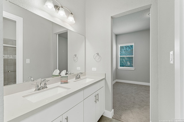 bathroom featuring vanity and a shower