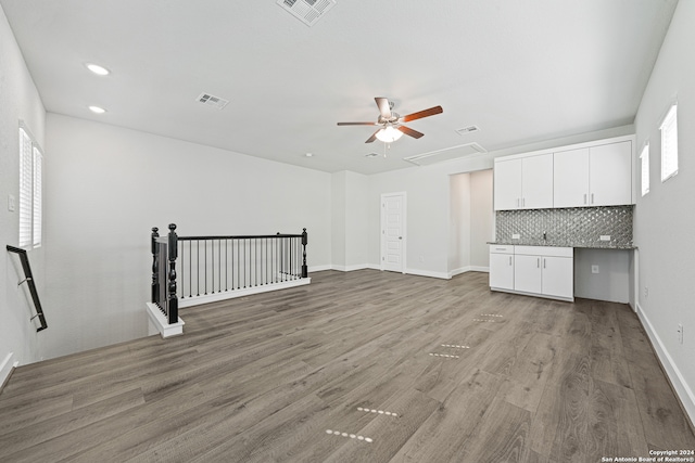 unfurnished living room with hardwood / wood-style flooring