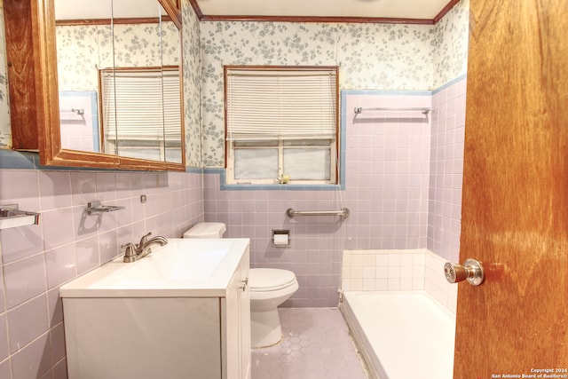 bathroom with vanity, tile walls, toilet, and tile patterned floors