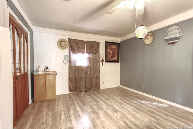 interior space with ceiling fan and hardwood / wood-style flooring