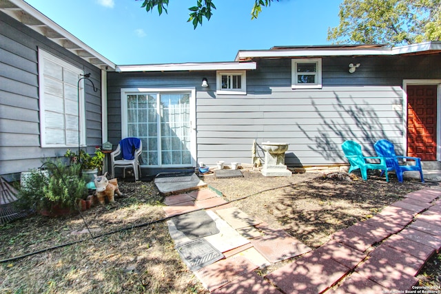 rear view of property featuring a patio area