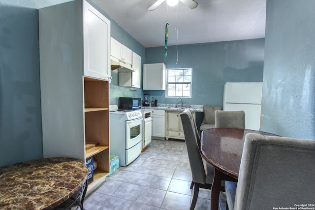 kitchen featuring white appliances, ceiling fan, sink, and white cabinets