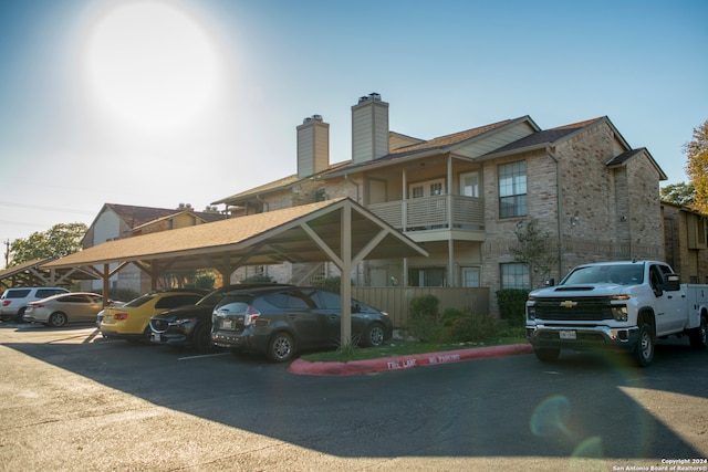 exterior space with a carport